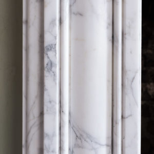 Carrara marble bullseye chimneypiece
