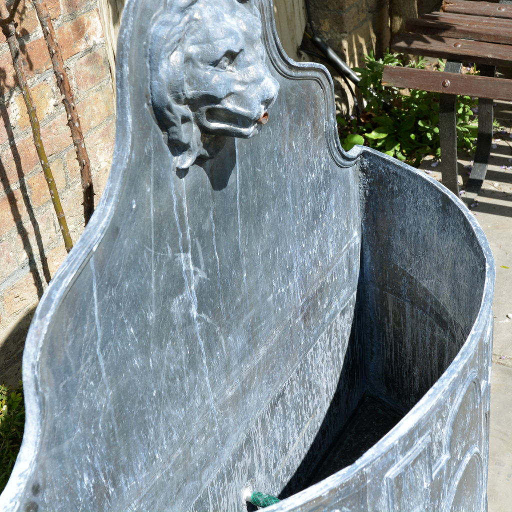 An English lead cistern with lion mask spout-88501