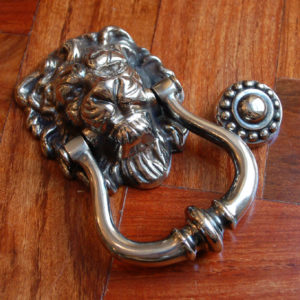 An English nickel-plated cast-iron lion-mask door-knocker,-0