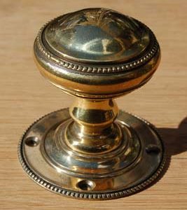 A pair of brass 'Beaded' door knobs-0