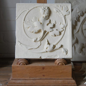 A cast plaster section of foliate frieze-0