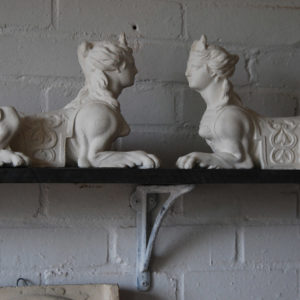 A pair of plaster Sphinx, cast in relief-0