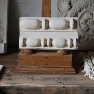 A cast plaster relief of 'reed and bead' mouldings-0