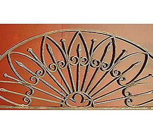 A Continental wrought iron demi-lune overdoor-0