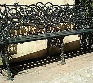 A cast iron three seater garden bench-0