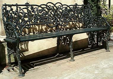 A cast iron three seater garden bench-0