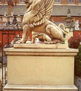 A large rectangular composition stone pedestal made en suite to the massive winged lion-0