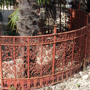 An ornate demi-lune Victorian wrought iron railing-0