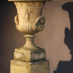 An English reconstituted stone semi-lobed Campana urn-0