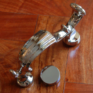 A nickel-plated brass door-knocker-0