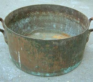 A large copper pot with brass lifting handles-0