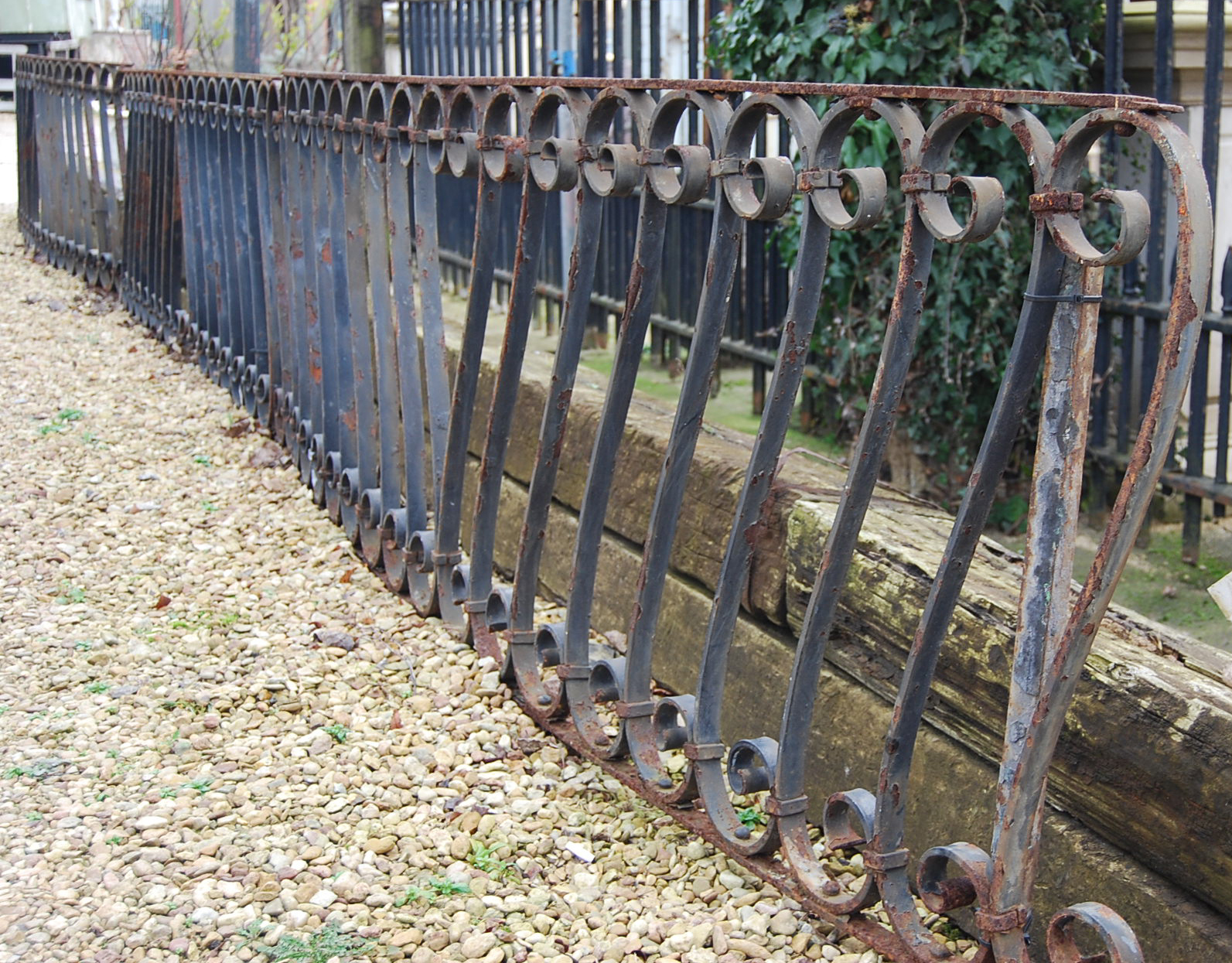 A run of scrolled wrought iron railing-0