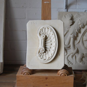 A relief plaster cast of an ornamental cabochon-0