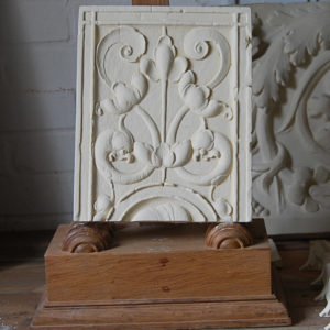 A cast plaster section of frieze-0