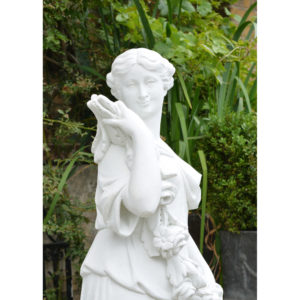 An Italian reconstituted marble figure of a maiden personifying 'Spring',-0