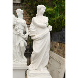 An Italian reconstituted marble figure of a maiden personifying 'Winter',-0