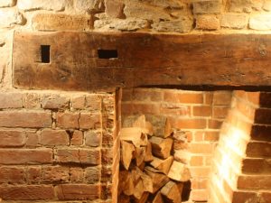 A fireplace lintel in Oxfordshire with Apatropaic marks