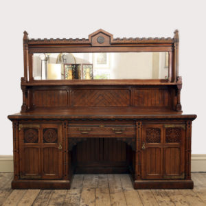 An imposing Reformed Gothic oak, walnut, ebonized and marquetry sideboard, -0