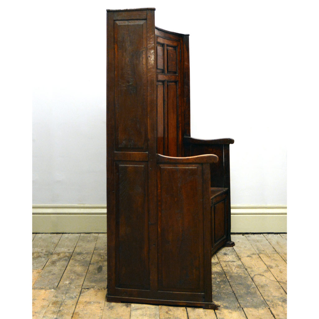 A late eighteenth century oak and elm curved bacon settle,-84249
