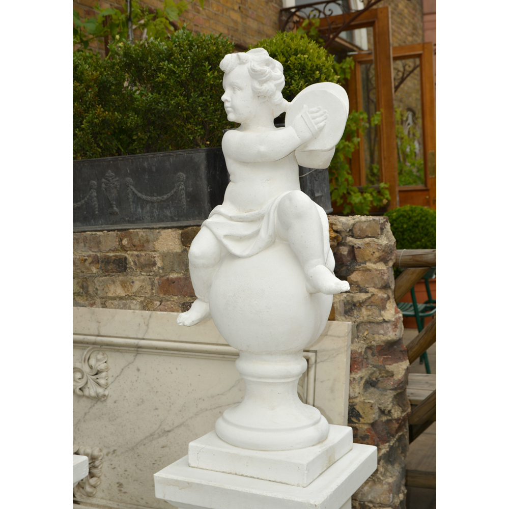 An Italian reconstituted marble statue of putti playing the piatti, -0