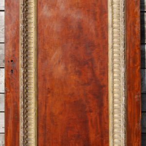 A large single panel mahogany door