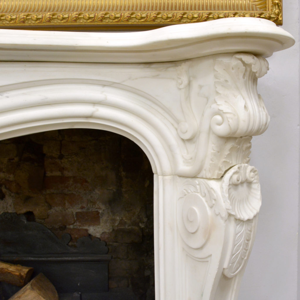 A large English Rococo Revival White Carrara marble chimneypiece,-87108