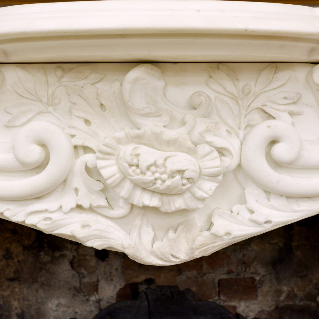 A large English Rococo Revival White Carrara marble chimneypiece,-87102