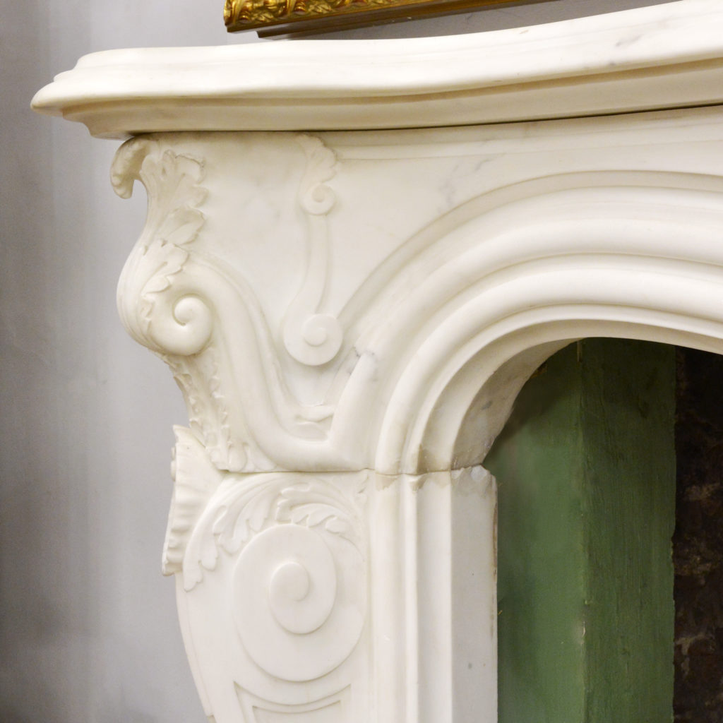 A large English Rococo Revival White Carrara marble chimneypiece,-87100