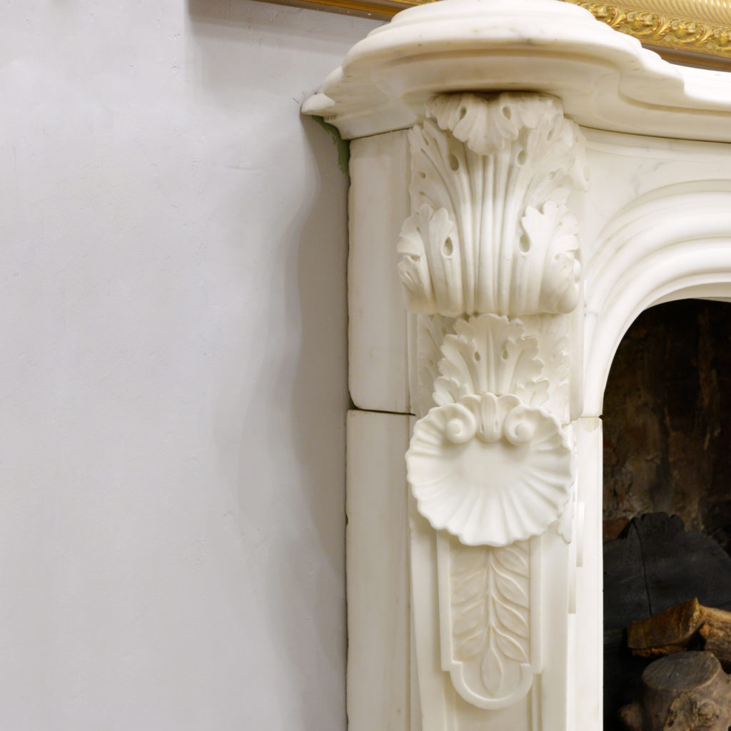 A large English Rococo Revival White Carrara marble chimneypiece,-87106