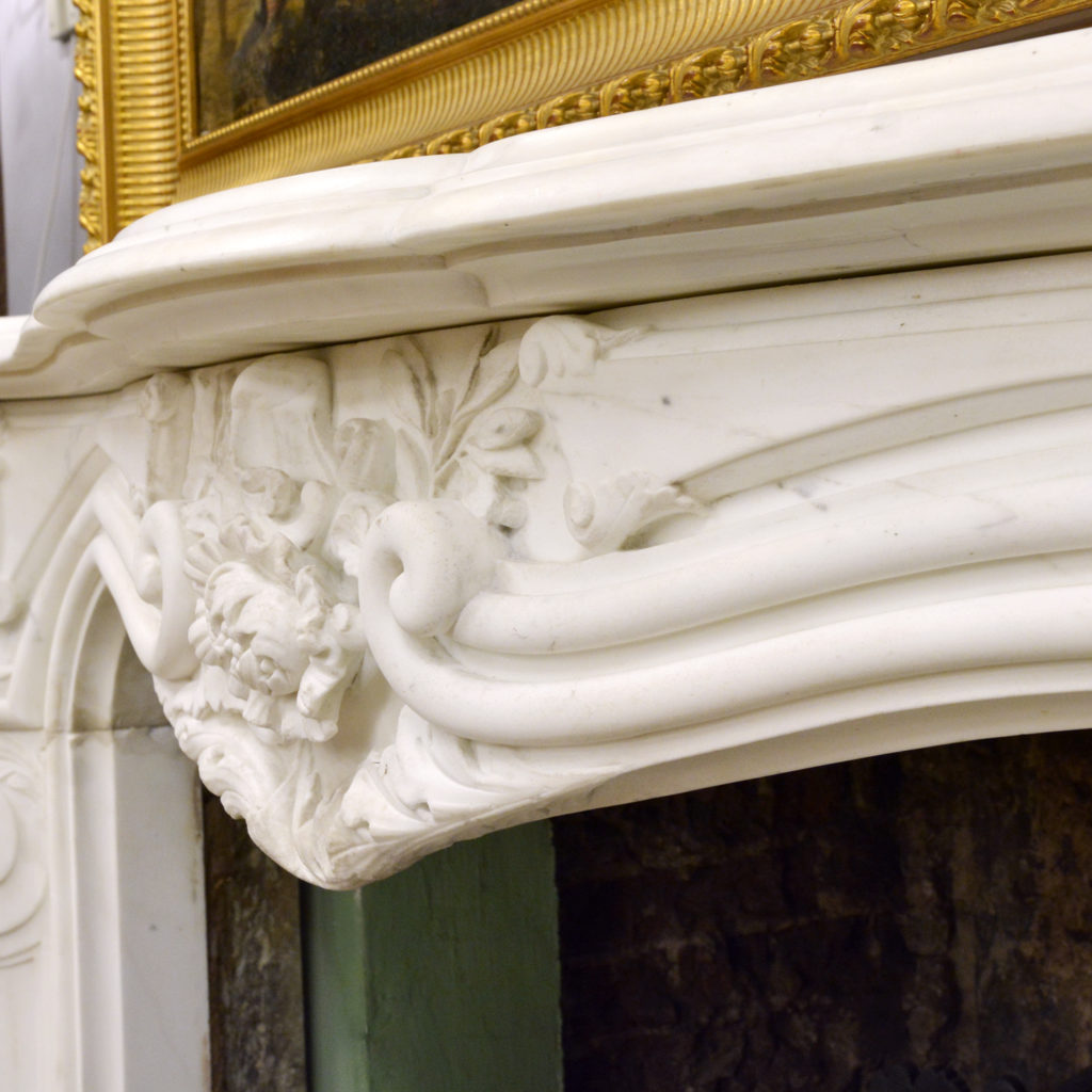 A large English Rococo Revival White Carrara marble chimneypiece,-87104