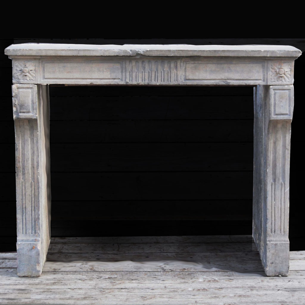 A Louis XVI Caen stone chimneypiece-0