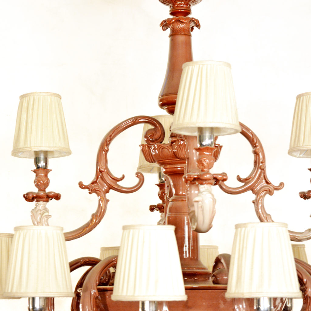 A large two tier sixteen branch ceramic chandelier,-87243