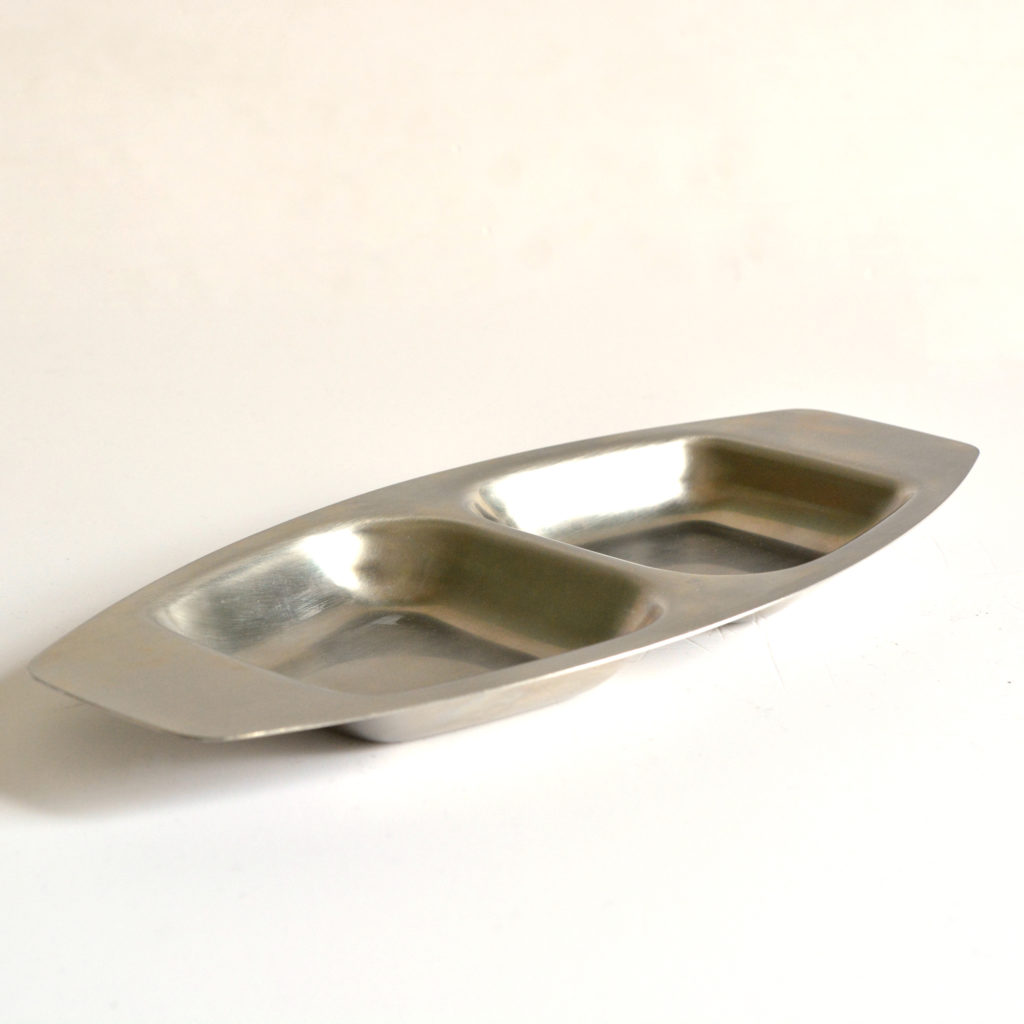 A large stainless steel serving dish,-0