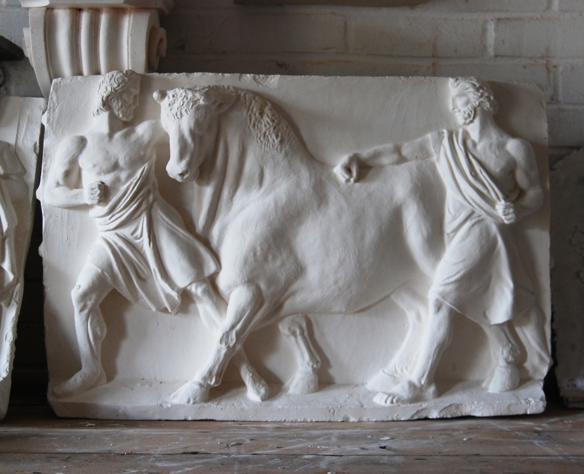 Plaster cast of men leading a bull, 42280