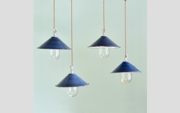 Small blue enamel pendant lights, £150 each.