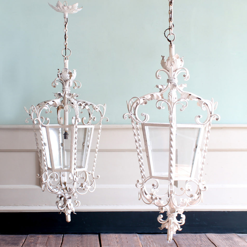 A pair of wrought iron lanterns, -0