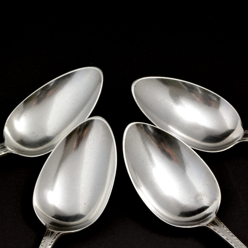 A set of four sterling silver dinner spoons,-94515