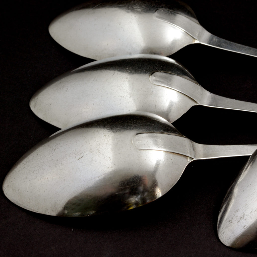 A set of four sterling silver dinner spoons,-94517