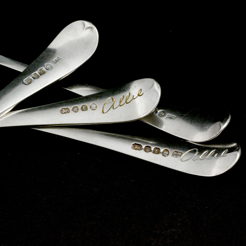 A set of four sterling silver dinner spoons,-94521
