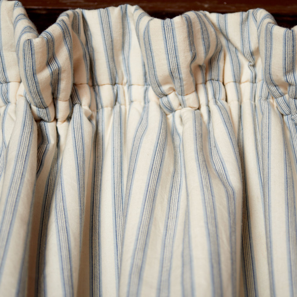 A pair of blue and white 'Ticking' curtains-96802