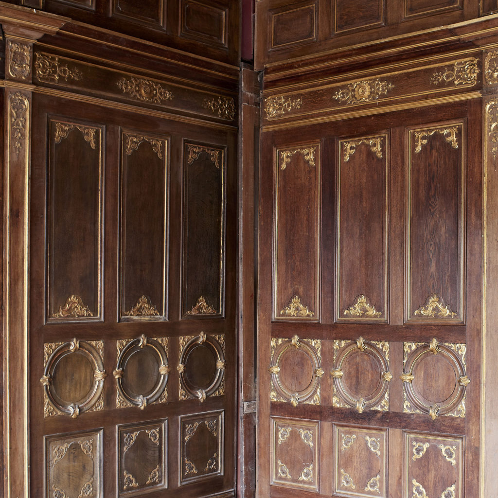 A spectacular French parcel-gilt oak panelled dining room,-0