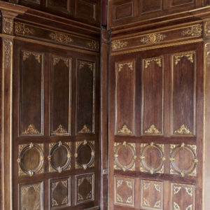 A spectacular French parcel-gilt oak panelled dining room,-0