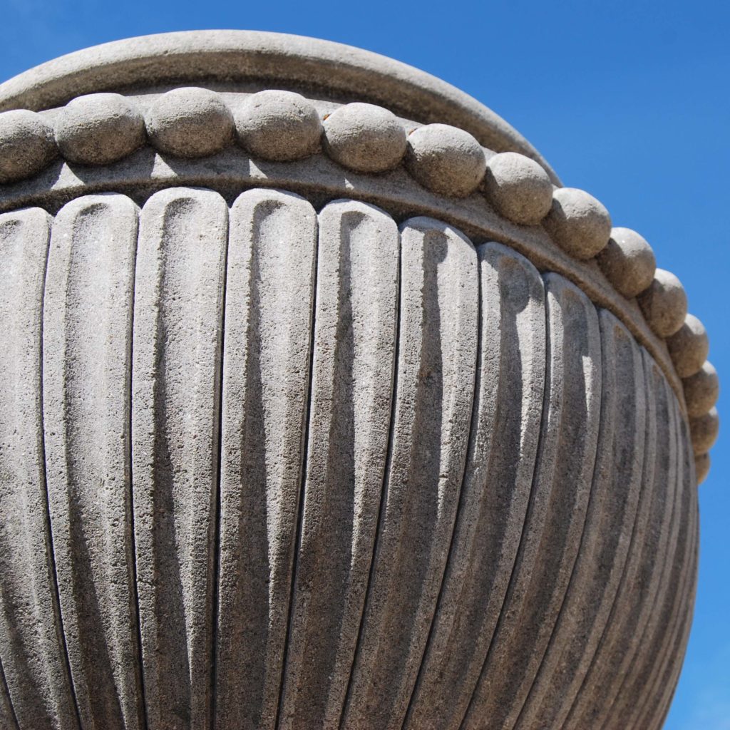 A carved limestone urn on pedestal-104267