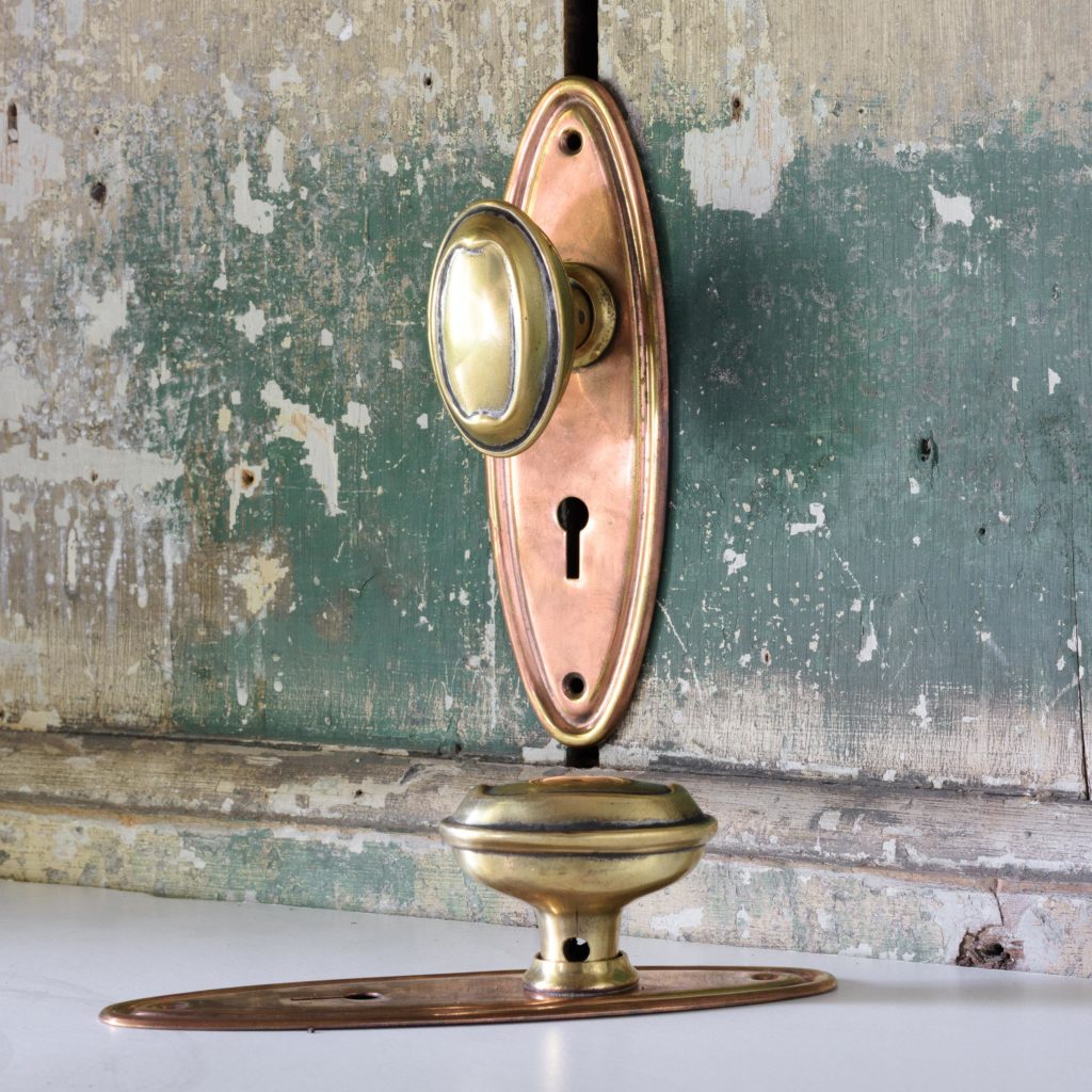 Pair of 1920s oval brass door handles,-0