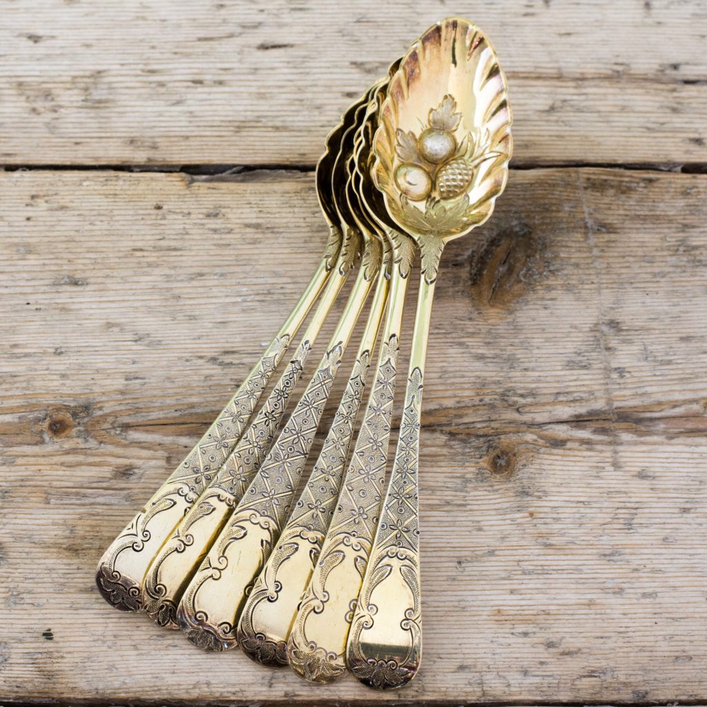 Set of six silver gilt fruit spoons,-0