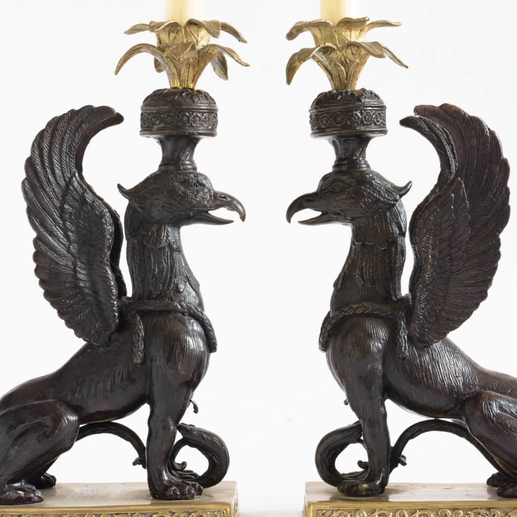 A pair of winged griffin bronze and brass table lamps,-0