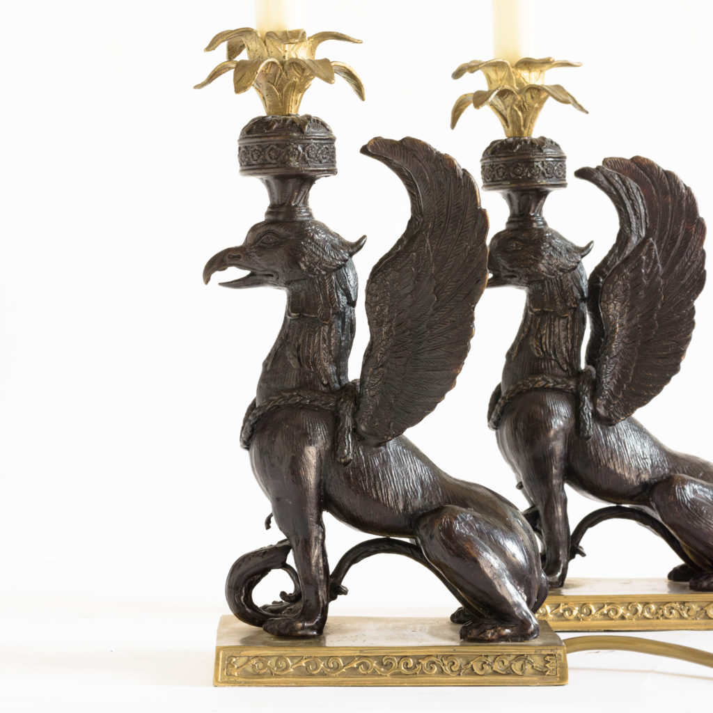 A pair of winged griffin bronze and brass table lamps,-106353