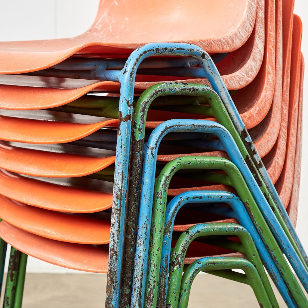 Distressed orange school chairs,-107478