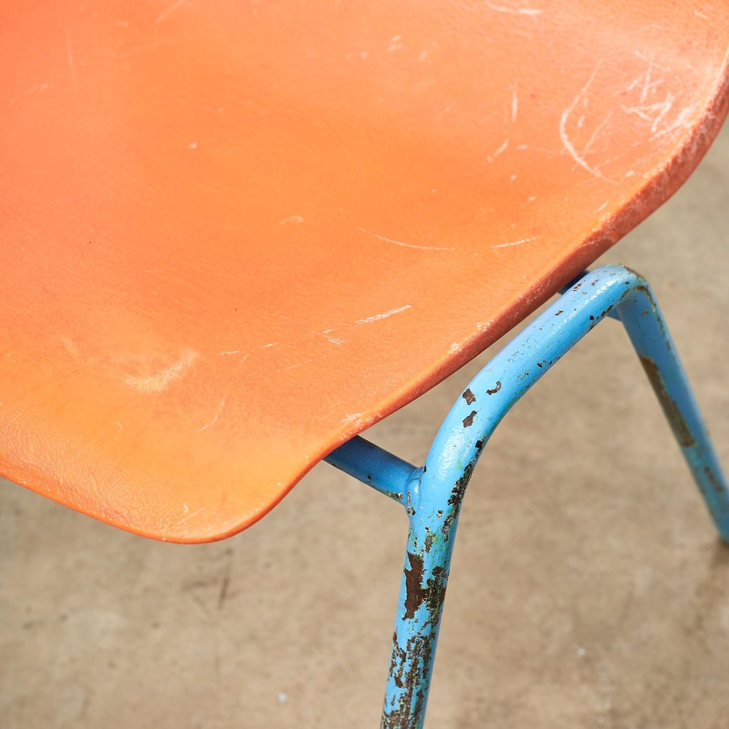 Distressed orange school chairs,-107471