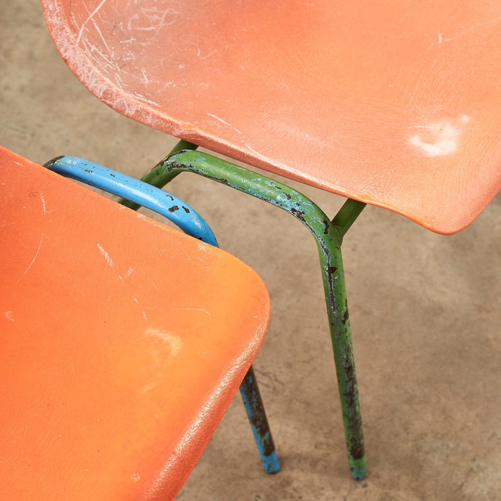 Distressed orange school chairs,-107476